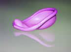 Side view of a pink non-latex contraceptive diaphragm called the Caya/SILCs